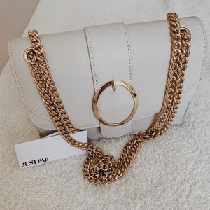 Just Fab creamy white purse.